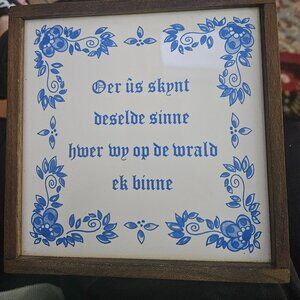 delft blue and white framed tile written in west frisian language